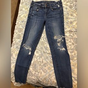 Dark wash distressed skinny jeans